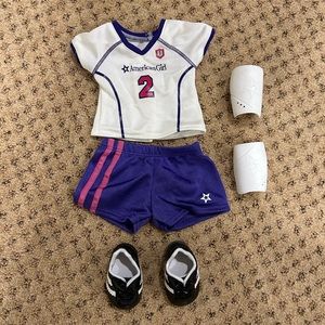 EUC American Girl Doll Soccer Outfit: shirt, shorts, shin guards, cleats.